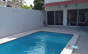 C12 · Casa 2 niveles, alberca y vista al manglar